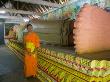 Yyoung Monk In Front Of Reclining Buddha, Wat Rathana Ransi by Noboru Komine Limited Edition Print