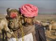 Indian Man With His Camel In The Desert by Scott Stulberg Limited Edition Pricing Art Print