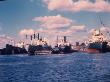 Esso Oil Tanker And Other Cargo Ships In Dock At Sun Shipbuilding And Dry Dock Co. Shipyards by Dmitri Kessel Limited Edition Print