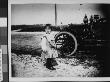 A Young Girl Standing Next To An Automobile by Wallace G. Levison Limited Edition Print