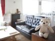 Teddy Bear On A Table In A Living Room by Atli Mar Limited Edition Print