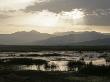 Dawn Over Swan Lake In Xinjiang Province, North-West China. June 2006 by George Chan Limited Edition Pricing Art Print